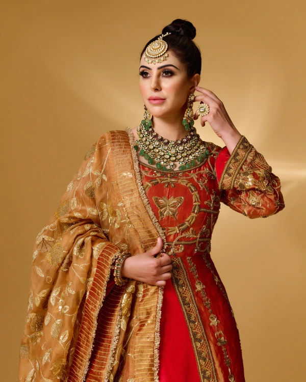 Bride in red anarkali with heritage gold jewellery